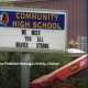screenshot of video showcasing community high school signage with message reading we miss you all braves strong